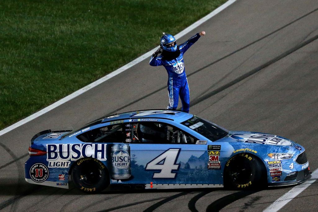 Kevin Harvick celebrates after winning the Spring race at Kansas Speedway in 2018. Harvick remains winless through 11 races this season.