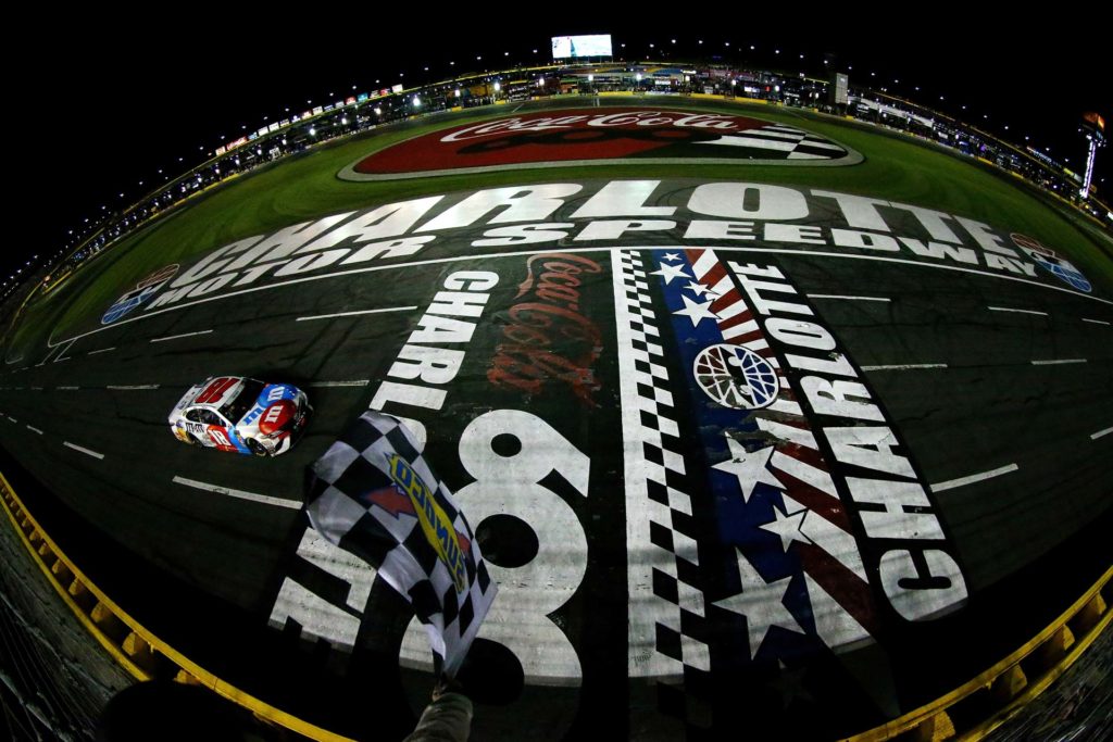 Kyle Busch takes the checkered flag and wins the Coca-Cola 600 last season at Charlotte Motor Speedway.