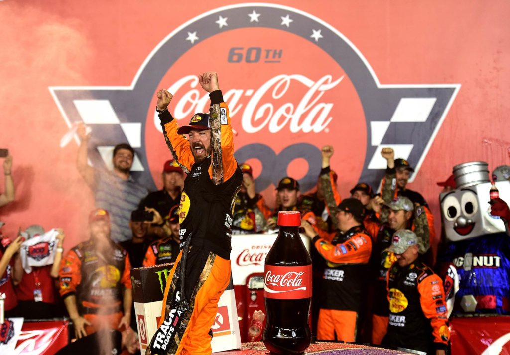 Martin Truex Jr. celebrates after winning the Coca-Cola 600 at Charlotte Motor Speedway