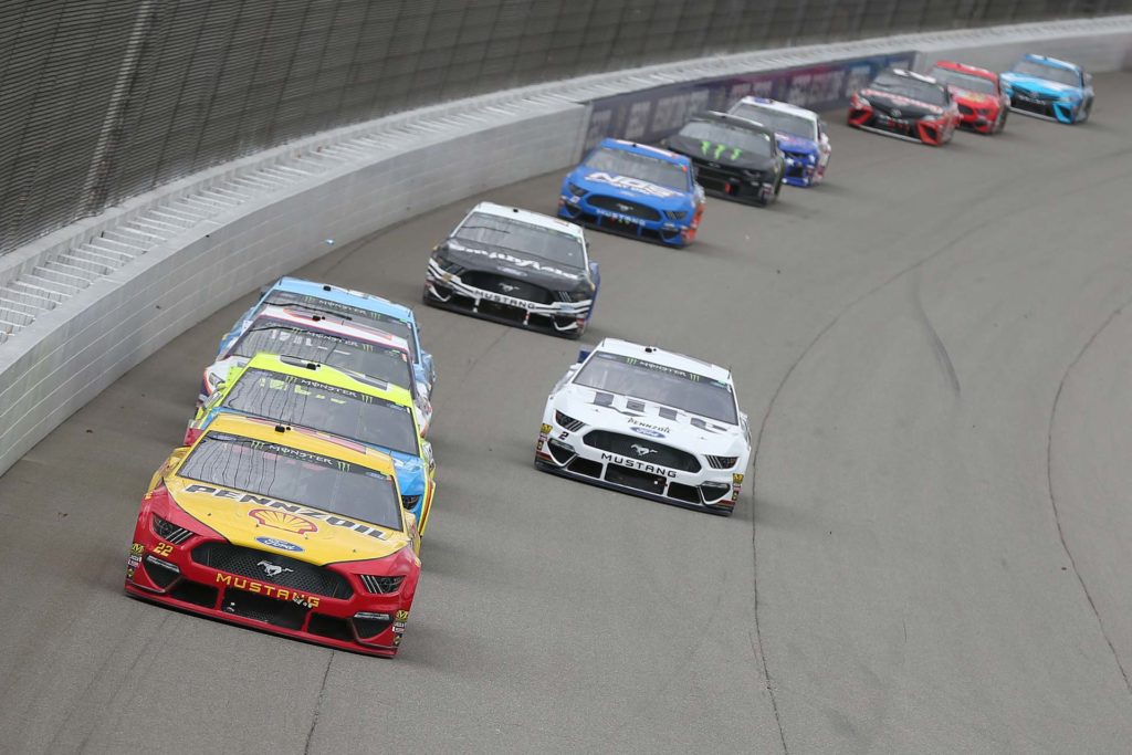 Joey Logano leads a pack of Ford Mustangs in the Firekeepers Casino 400 at Michigan International Speedway