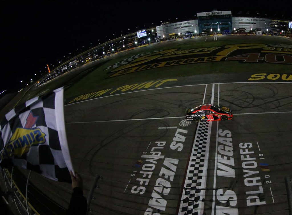 Martin Truex Jr. takes the checkered flag to win the South Point 400