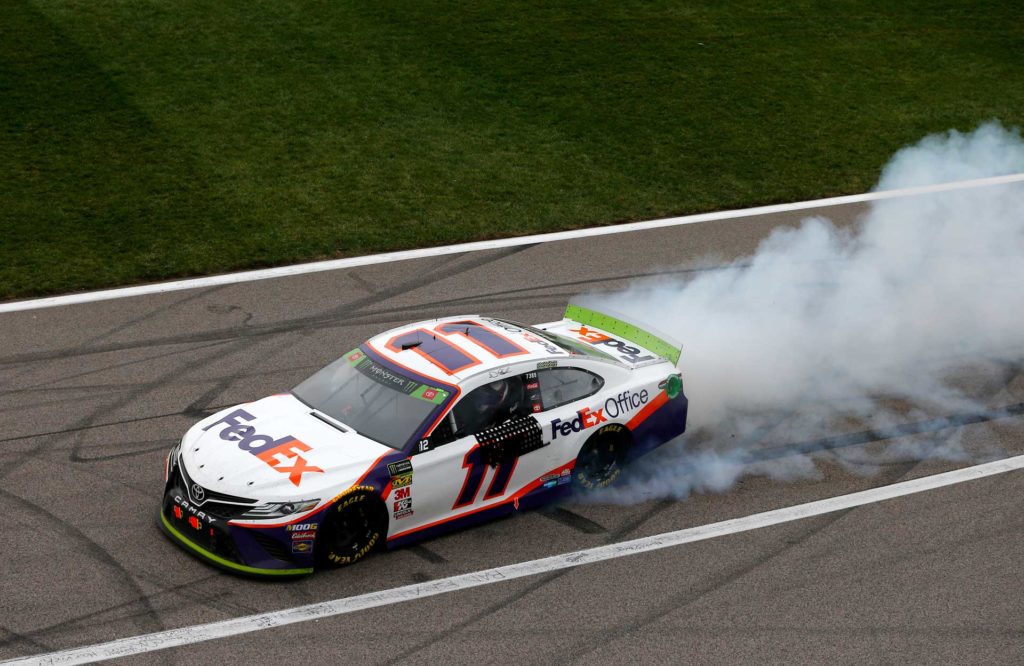 Hamlin celebrates on the frontstretch after winning the Hollywood Casino 400 at Kansas Speedway