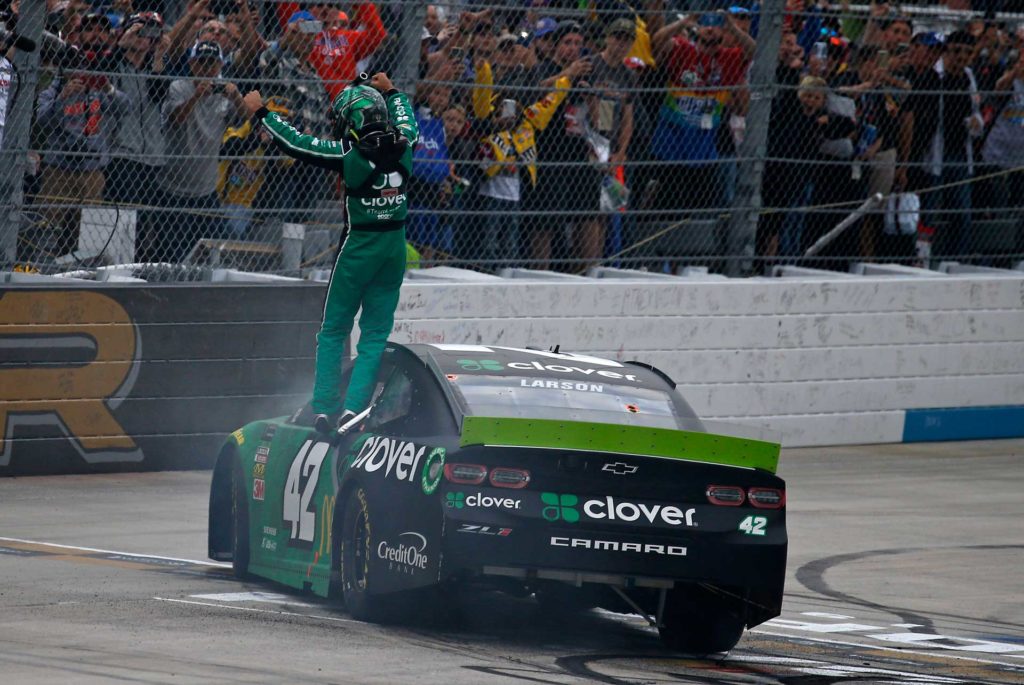 Kyle Larson celebrates on the frontstretch after winning the Drydene 400 at Dover International Speedway