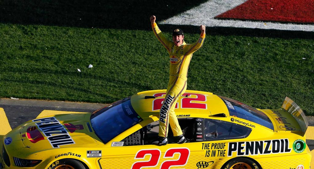 Joey Logano celebrates with the crowd after winning at Las Vegas.